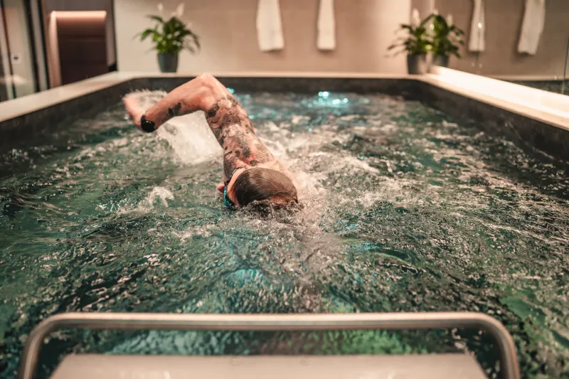 A member swims in the rehabilitation pool at The FIT Partnership