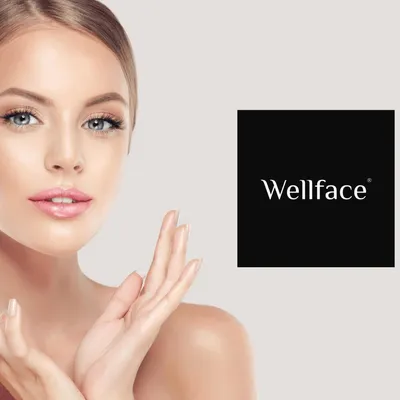 Wellface logo alongside a close-up promotional beauty model photo